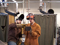 Image of two welders