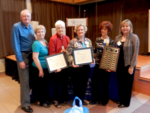 Academy for Lifelong Learning Gigi Hancock Doris Humphress holding the 2011 Volunteers of the Year award