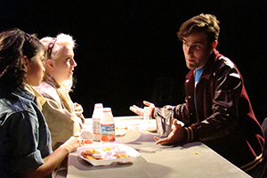 Actors Workshop students at a table