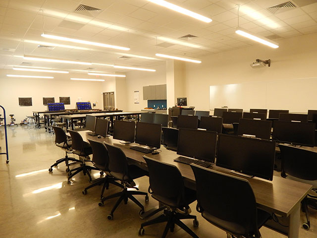 Classroom with Computers on Student Desks