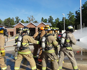 Fire fighters putting out fire