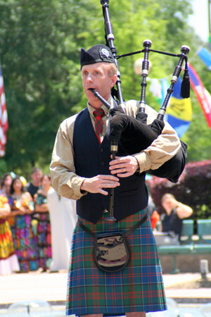 Craig Livingston playing bagpipes in World War I attire
