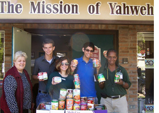 Performance Troupe donates canned goods to Mission of Yahweh