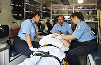 EMS photo of three students in an ambulance