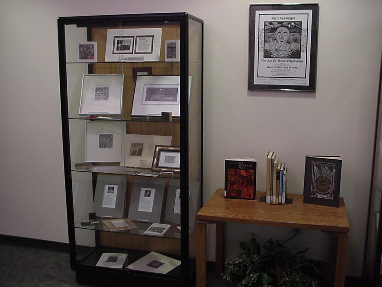 One display case and the table of relevant circulating books from the library's collection.