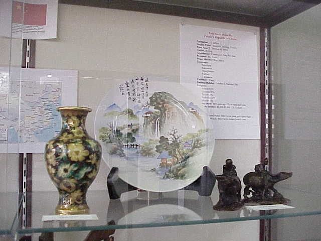Close up of several pieces and the "Fast Facts About China" list.