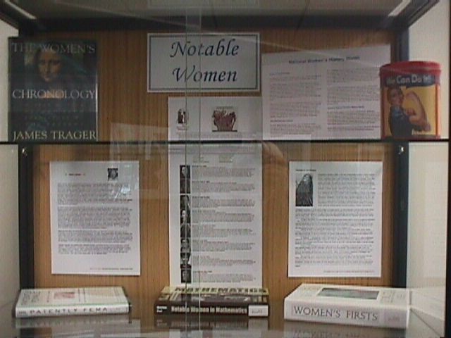 Top two shelves of the international women display case (biographies visible here are for Hedy Lamarr and Hildegard von Bingen)
