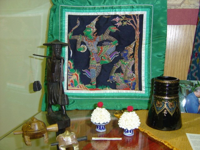 Here we see wood sculptures, soap sculptures, lacquerware, and a silk pillow.
