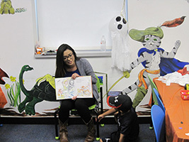 Lauren Ringor reads to children