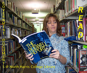 Laurie Heeth, NHC Library Administrative Assistant, reads about the government's search for aliens only to find them in the library.