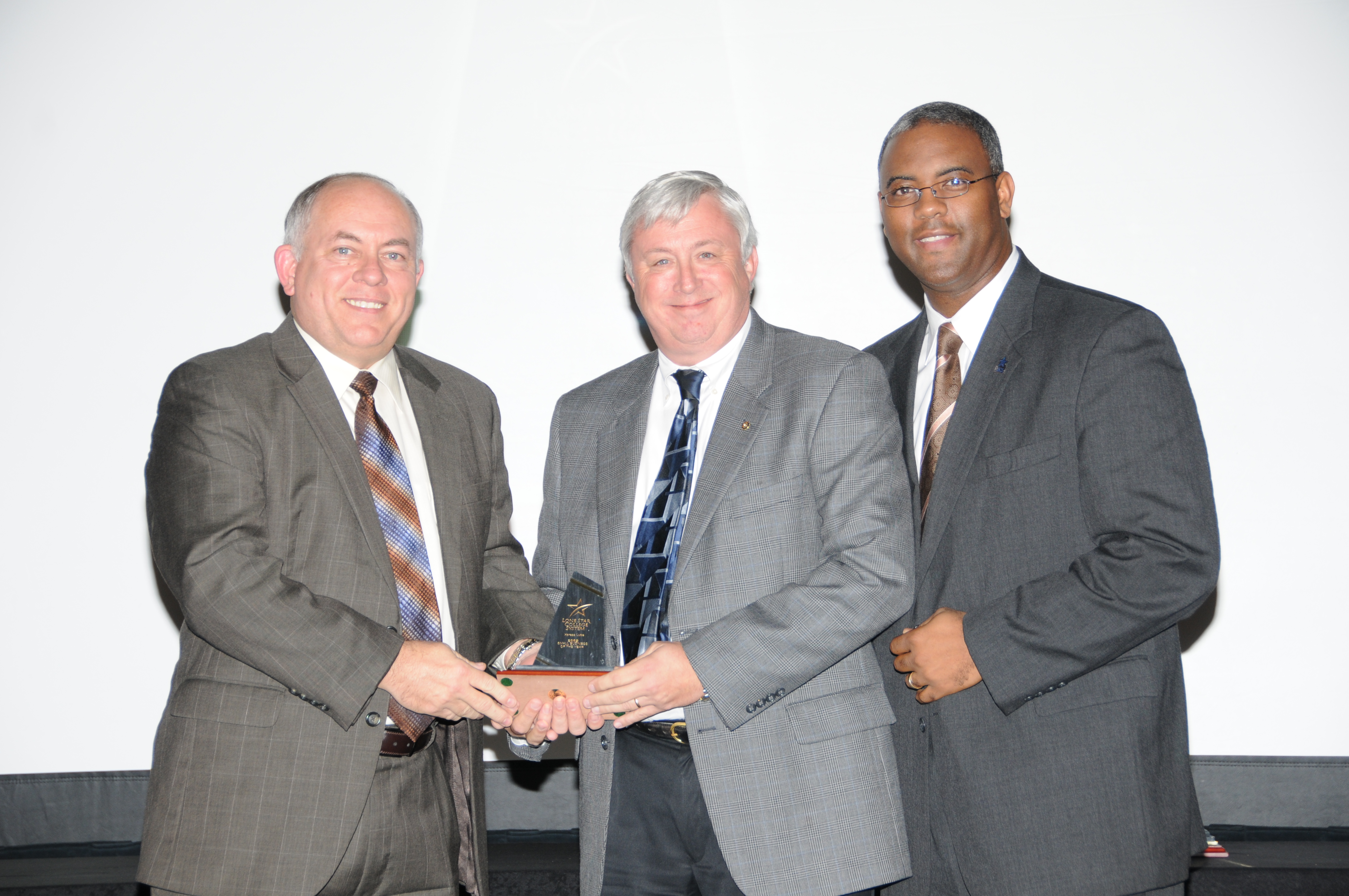 Jeff Early, Xpress Lube, center, representing the LSC-Montgomery area, with Dr. Richard Carpenter, left, and Dr. Austin Lane, right, LSC-Montgomery president.