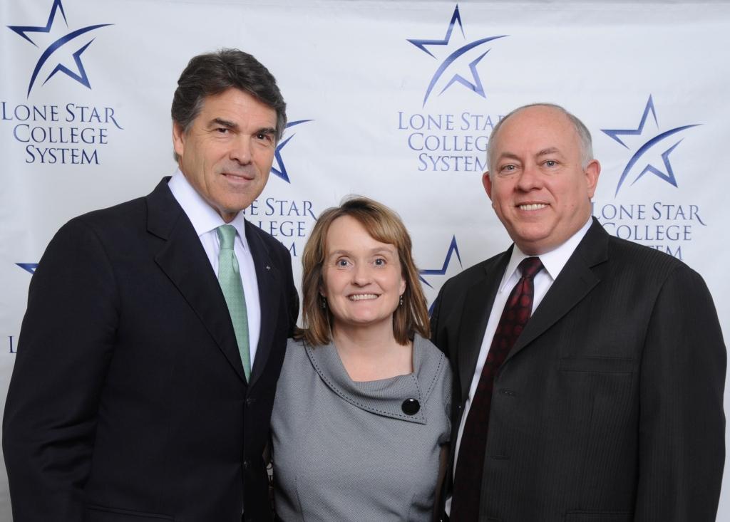 Texas Gov. Rick Perry, left, is pictured at the North Houston Economic Symposium on Feb. 11 with Chancellor Dr. Richard and Dana Carpenter. 