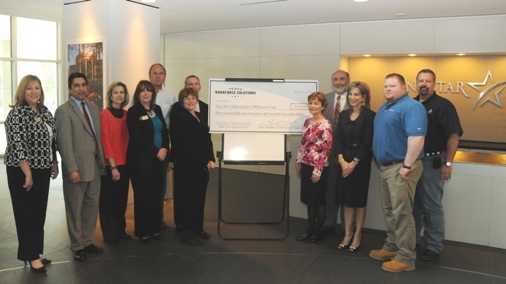 Pictured at the Skills Development Fund grants check-signing presentation on March 11 at Lone Star Corporate College are, left to right, Bonnie Dean, LSCC director of business development and sales; Andres Alcantar, TWC commissioner; Rhonda Beard, vice president of HR, Lectrus Corp.; Pattie Harakal, director of implementation for LSCC; Tom Laursen, vice president of Lectrus Houston; Cris Neuman, HR manager, Lectrus Houston; Rand Key, LSCS senior vice chancellor, COO; Liz Wright, grant coordinator Lectrus Houston; Larry Temple, TWC executive director; Linda Head, LSCS associate vice chancellor; Richard Woodell, trainee, Lectrus Houston; and Jeff Harris, director of apprenticeship, Godwin SBO.