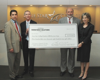 Pictured at the Skills Development Fund grants check-signing presentation on March 11 at Lone Star Corporate College are, left to right, Andres Alcantar, TWC commissioner; Rand Key, LSCS senior vice chancellor, COO; Larry Temple, TWC executive director; and Linda Head, LSCS associate vice chancellor.