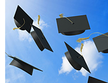 Graduation caps thrown in air