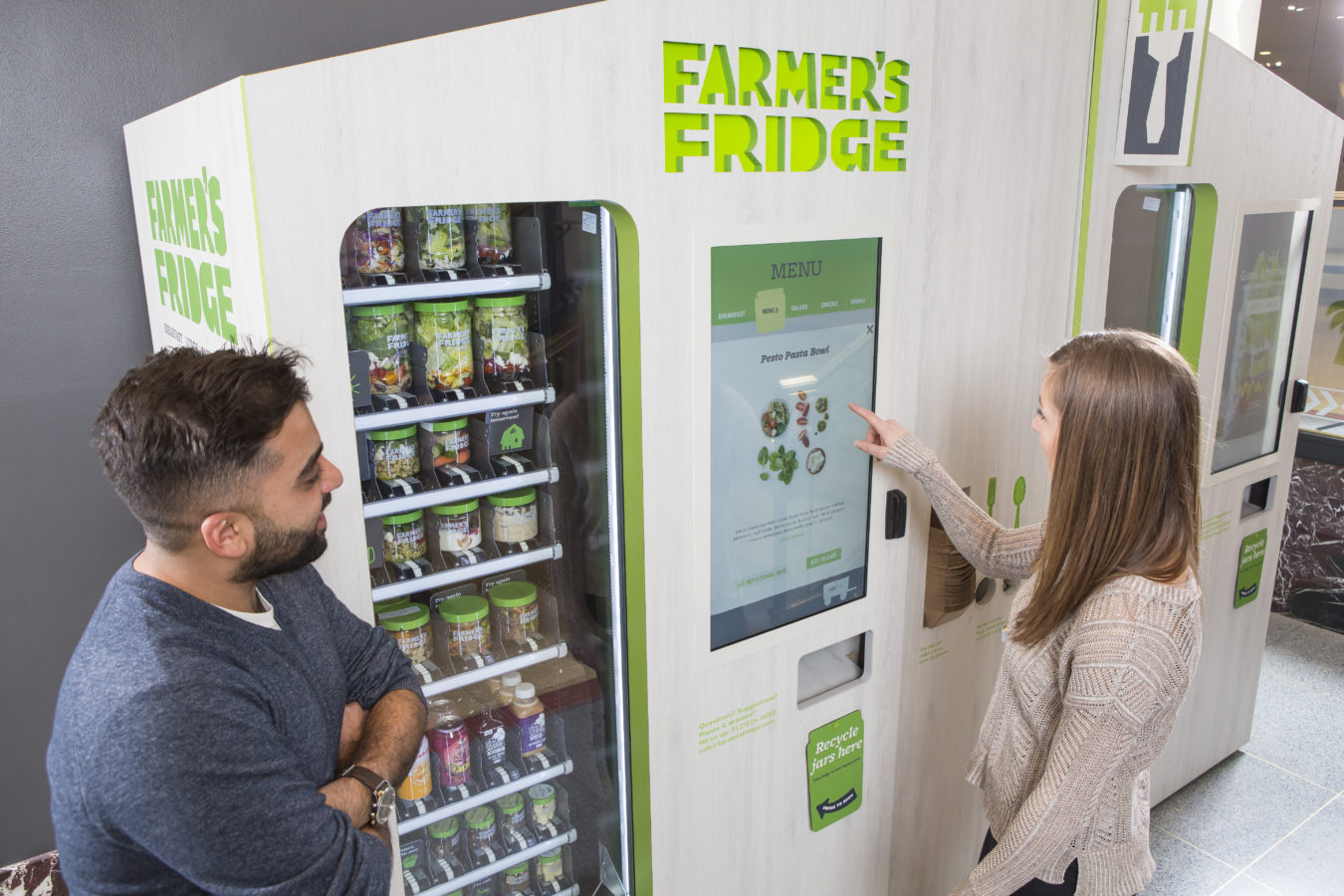 Image of people buying food from the Farmer's Fridge machine