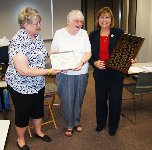 Nancy Price (center), was recently named the 2010 Instructor of the Year by Lone Star College-Montgomerys Academy for Lifelong Learning. Judi Bonds (on left), ALL advisory council chairman, and Donna Smith Burns (on right), ALL program coordinator, present Price with her certificate and plaque.