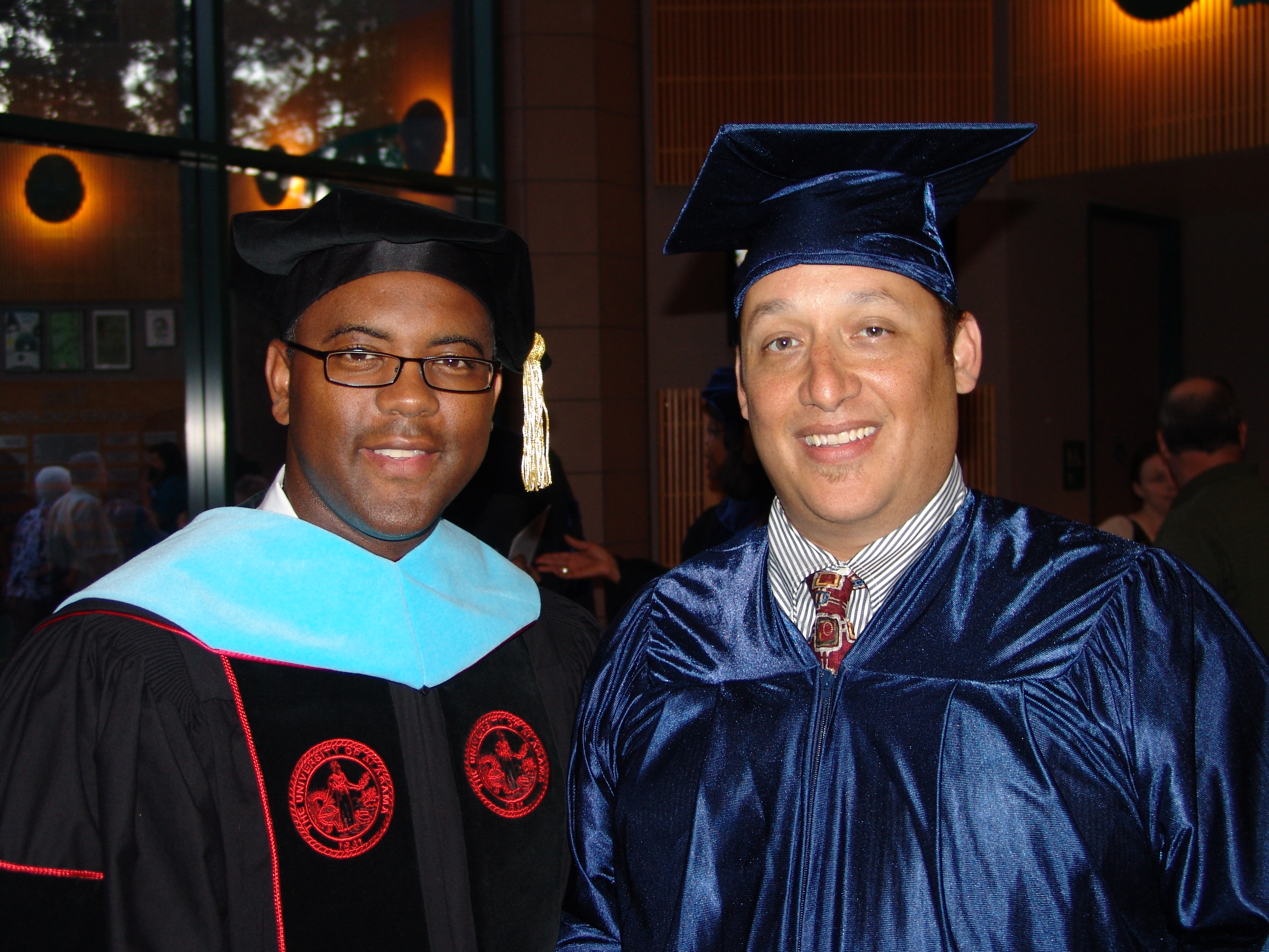 Dr. Austin Lane (left) congratulates Dominic Vessell, who recently completed the General Educational Development (GED) program through Lone Star College-Montgomery. Vessell also served as the student speaker during the GED Commencement ceremony.