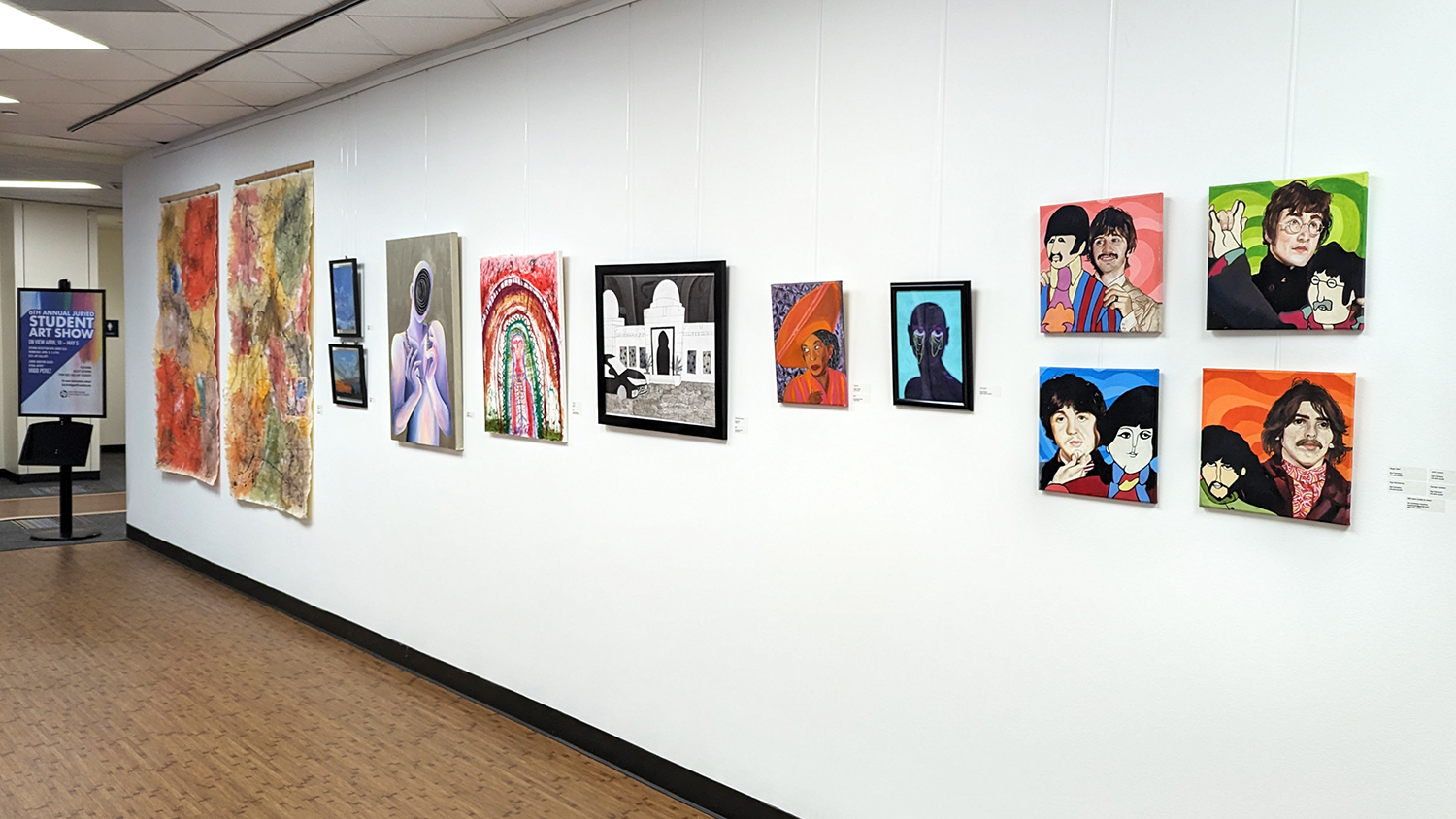 Photo of the 12.1 art gallery with paintings and other artwork on the walls