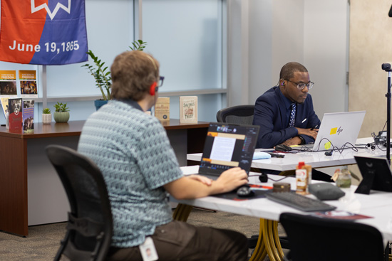 Tyler Wurz, LSC-Tomball Virtual Reality Coordinator (left) and Patrick Gilbert, LSC-Tomball Political Science Professor (right), manage the technical, logistical, and experiential aspects of the Virtual Juneteenth Conference.