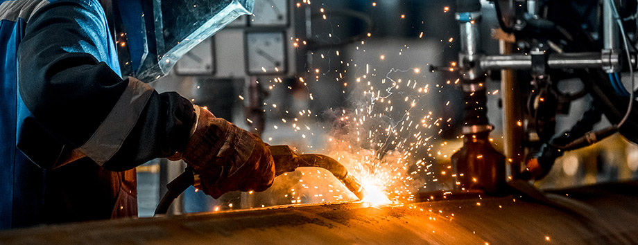 Welder working on a pipe.