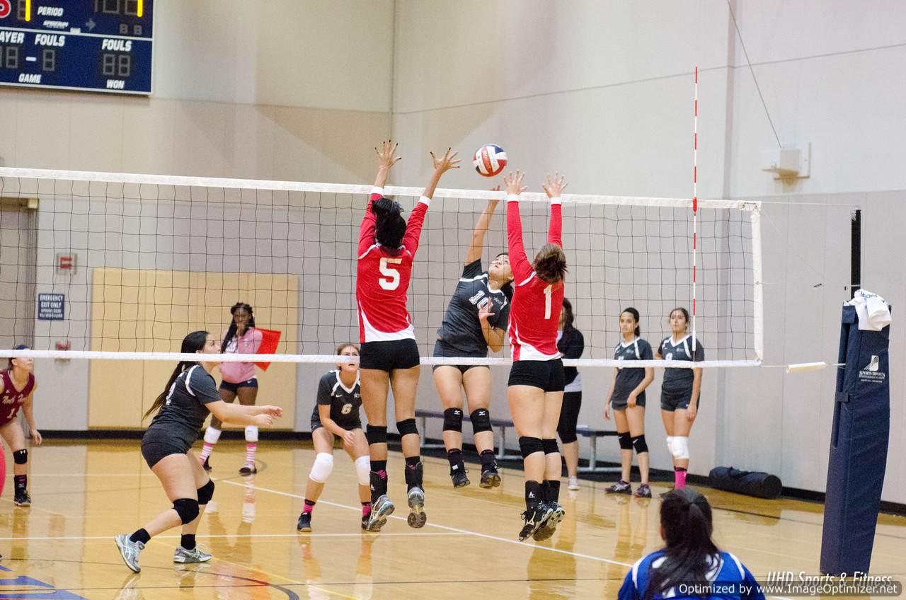 Photo of student from different teams playing volleyball