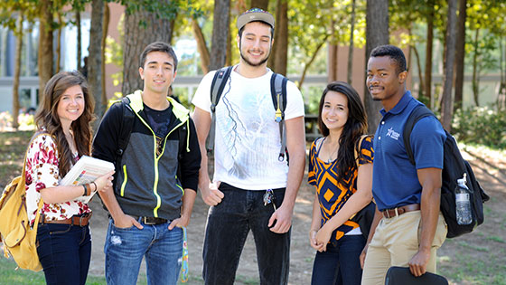 Image of a group of students standing on campus