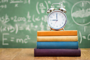 Clock sitting on books