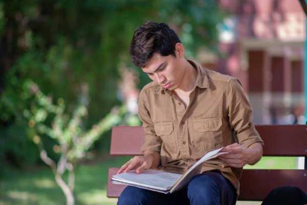 Student sitting on bench