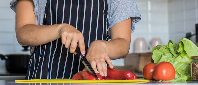 Slicing peppers on cutting board