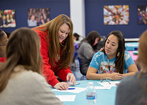 Teacher and students working together 
