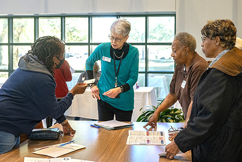 People standing around a table