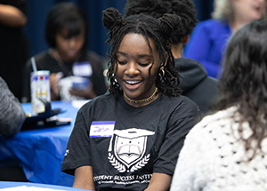 SSI Student at chatting with mentor at welcome event 