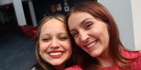 Two girl students smiling 