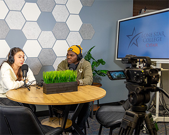 Students using the Multimedia Cemnter to create a high-quality video