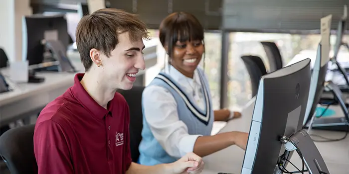 Two students at a computer
