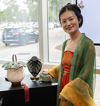 Graphic Designer Yating Zhang's three wearable ceramic pieces "Green Dream" took first in Ceramics 1.