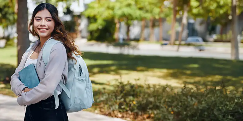 Woman with a backpack on looking to her left