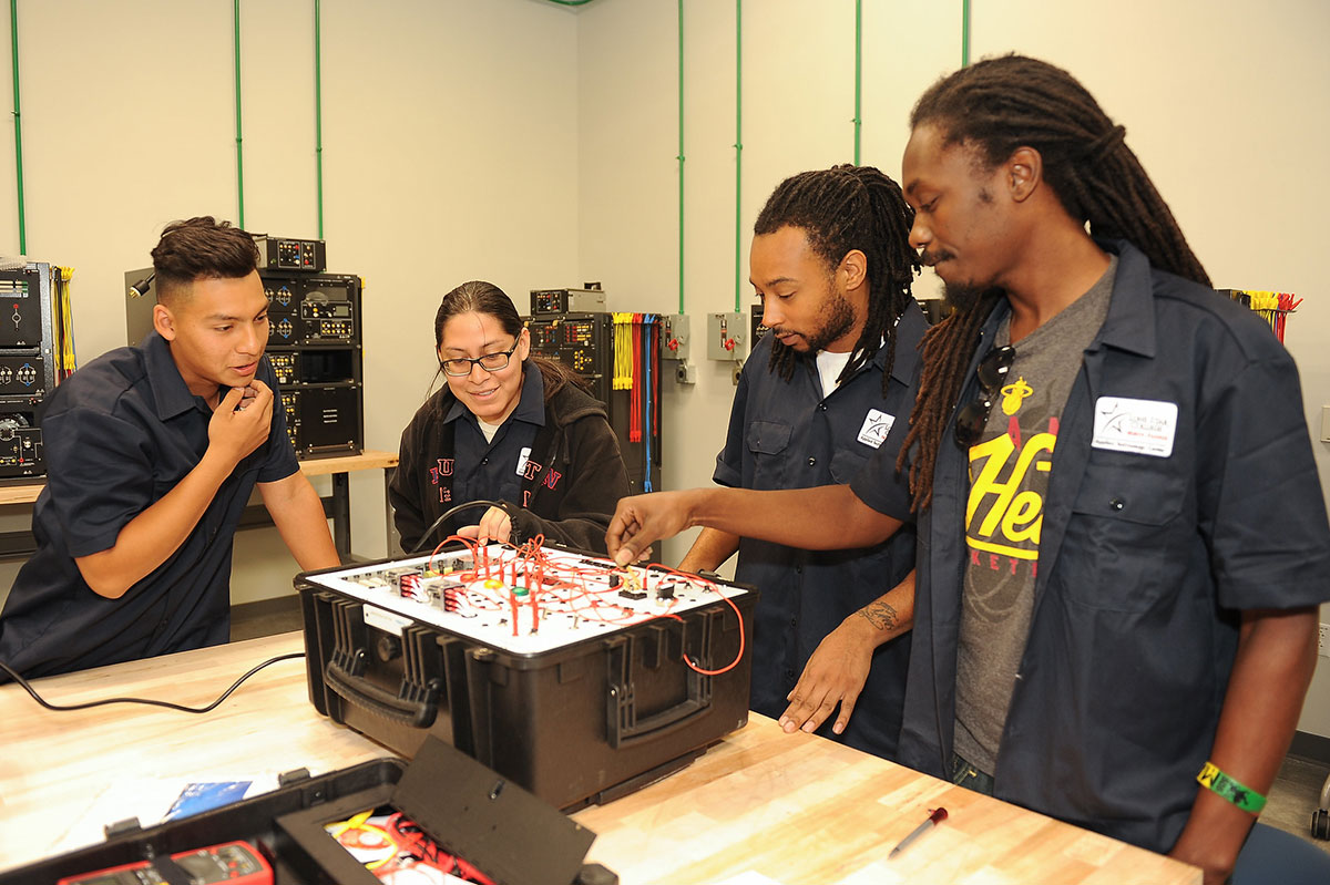 Photo of students at an electrical box