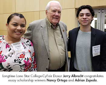Longtime Lone Star College-CyFair Donor Jerry Albrecht congratulates essay scholarship winners Nancy Ortega and Adrian Zepeda.