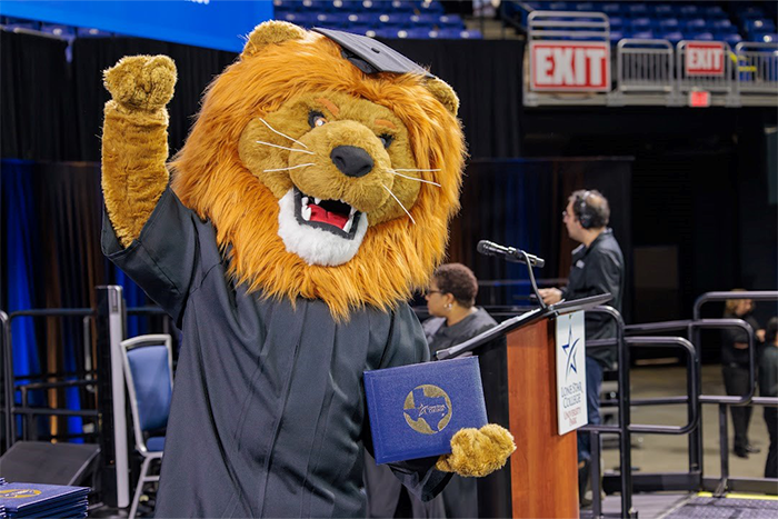 May 2022 Commencement Photo of Graduates with Leo the Mascot