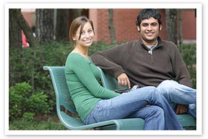 two students sitting on bench