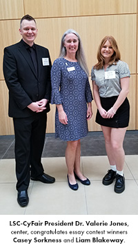 LSC-CyFair President Dr. Valerie Jones, center, congratulates essay contest winners Casey Sorkness and Liam Blakeway.