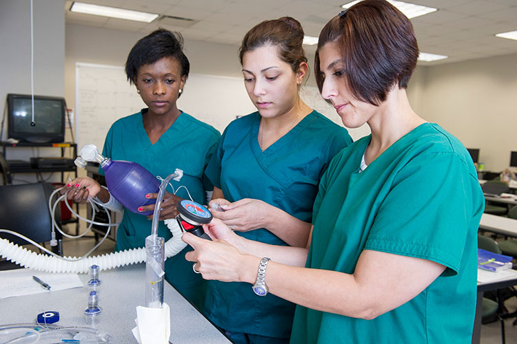 LSC-Kingwoods health care programs continually earn high marks on national exams. Pictured are students working with respiratory care equipment.