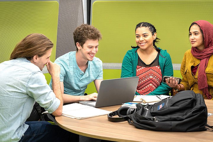 Four Students sitting at a table at Lone Star College-Kingwood