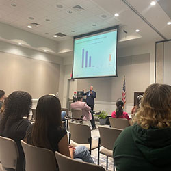 Photo of a speaker presentation