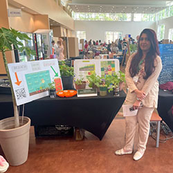 photo of a student with her poster project