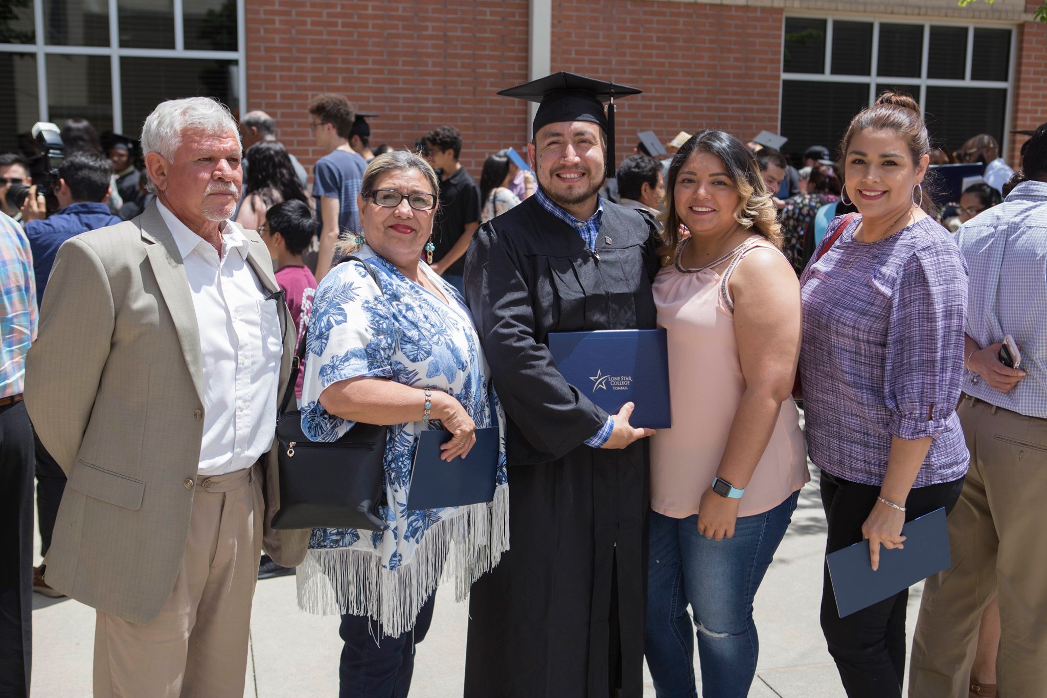 Photo of graduate and family