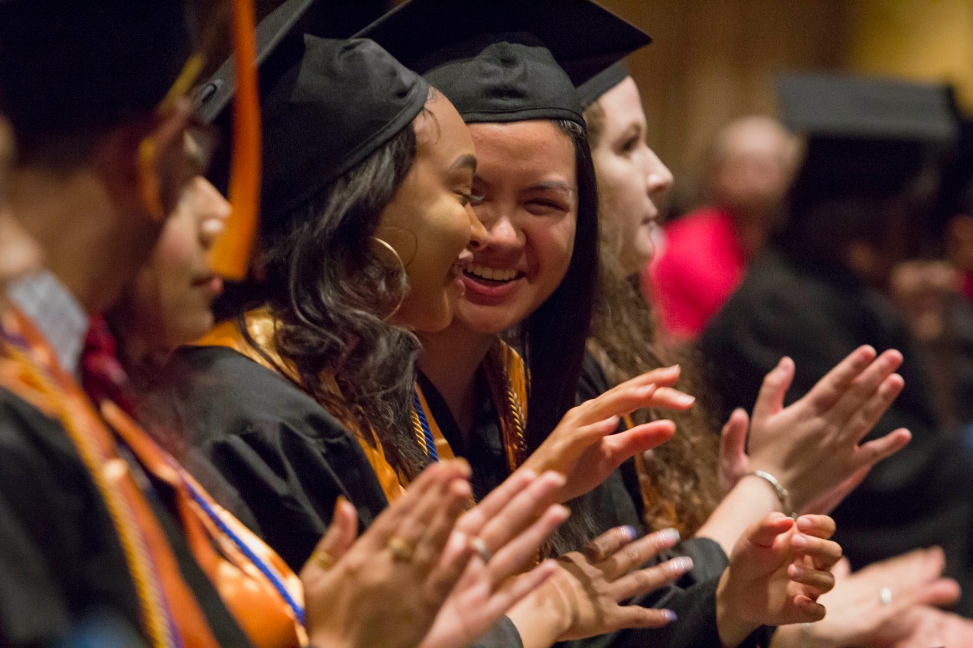 Photo of graduates clapping