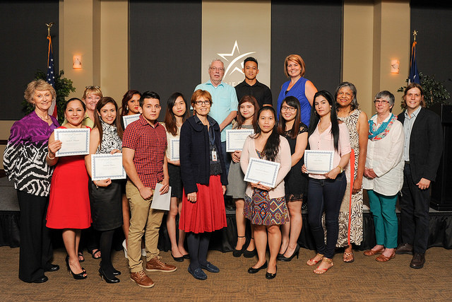 group of students holding certificates